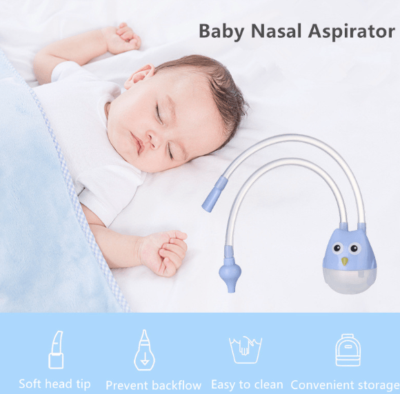 Baby on bed with nose aspirator