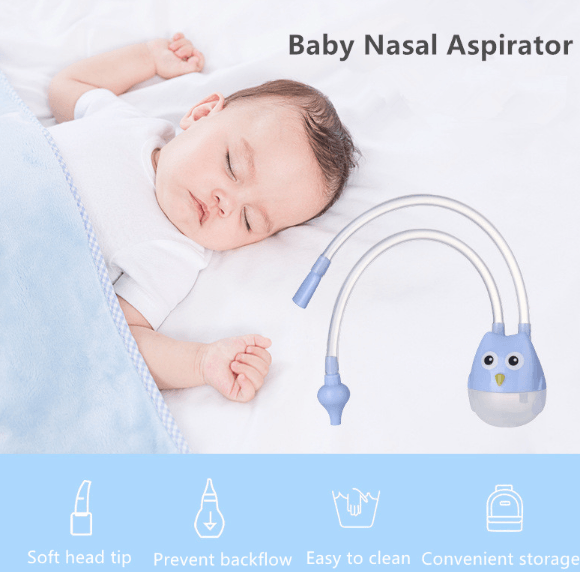 Baby on bed with nose aspirator 