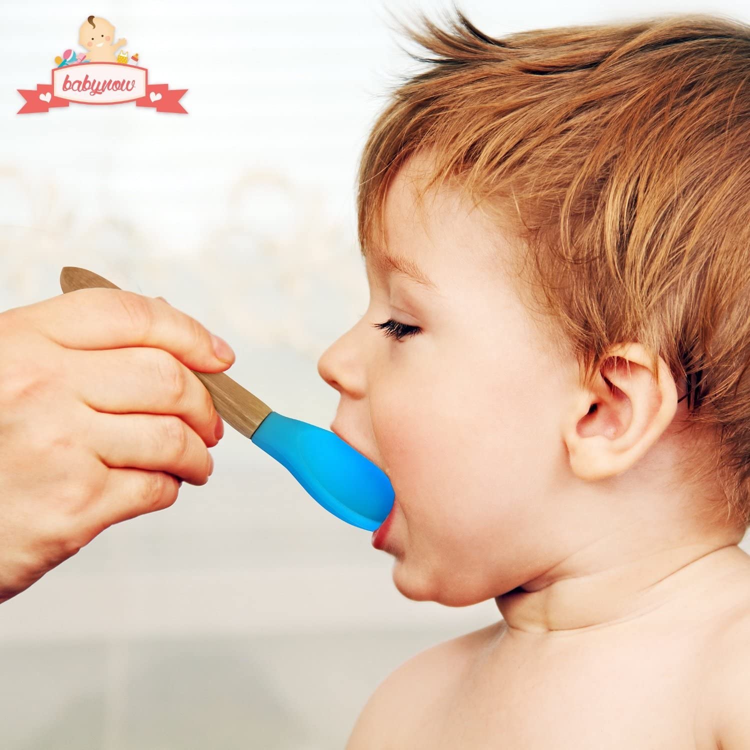 baby feeding with blue spoon